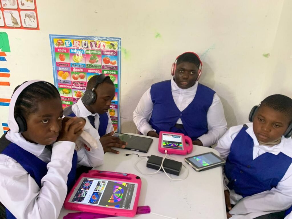 Special needs kids using assistive technology (tablets, ipads and headsets)